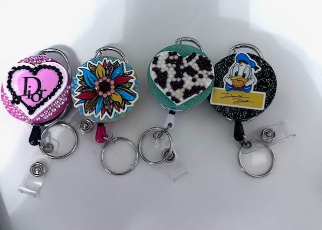 Badge Reels with and without rhinestones