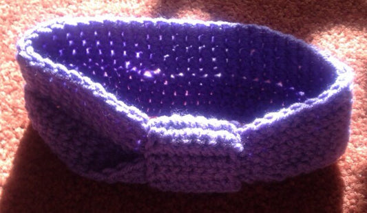Handmade crochet headband.  Light purple with knot. 8”